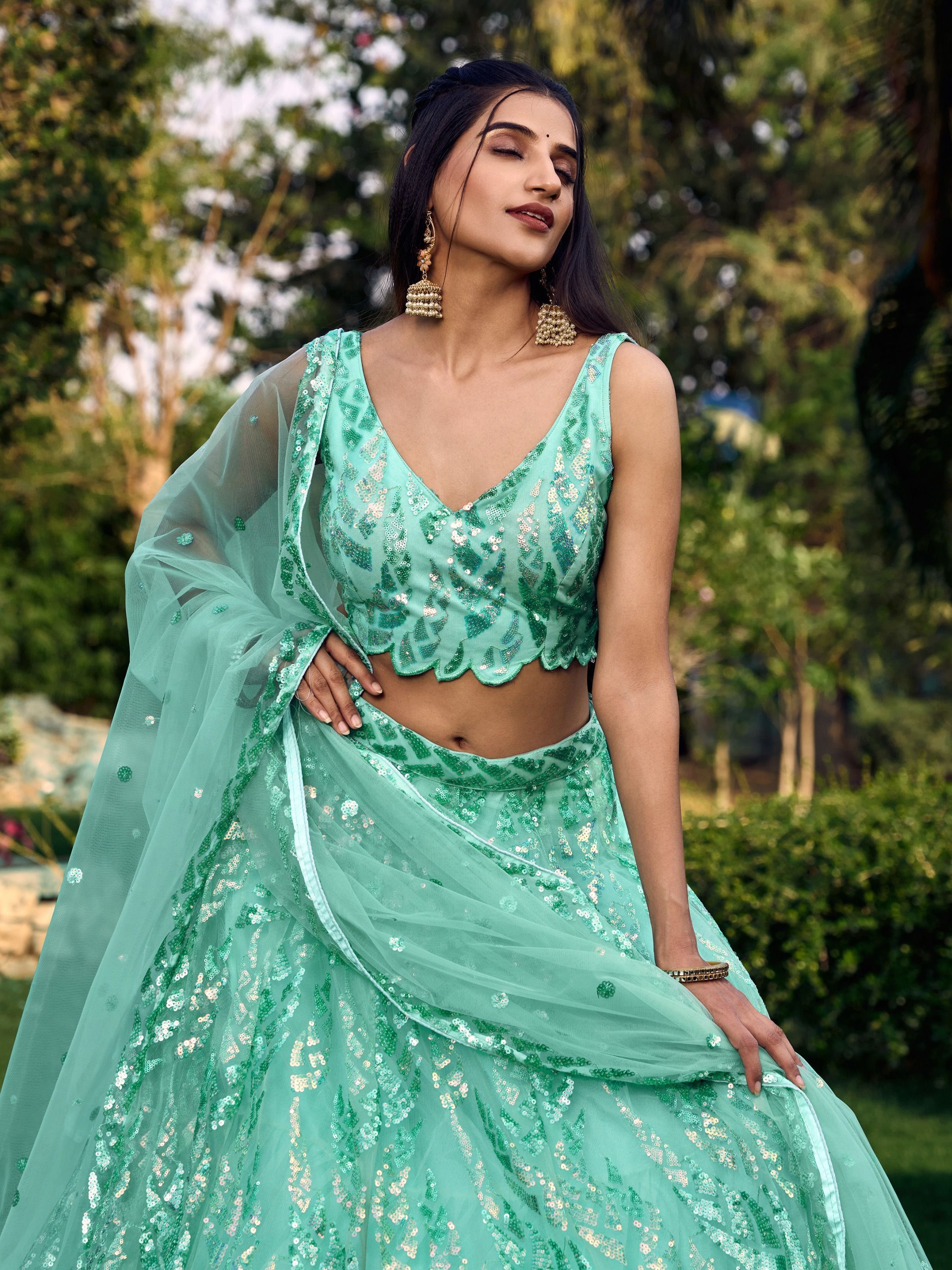 Turquoise Soft Net Lehenga Choli with Heavy Multi Sequins Embroidery and Lace Border Dupatta Perfect for Weddings and Glam Parties